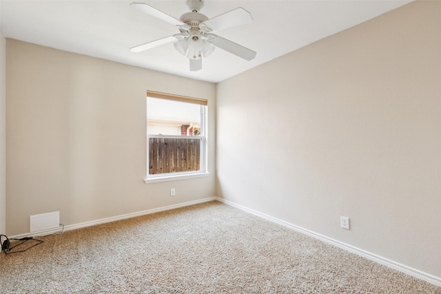 carpeted empty room featuring ceiling fan