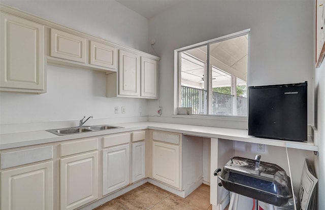 kitchen with sink and light tile patterned floors