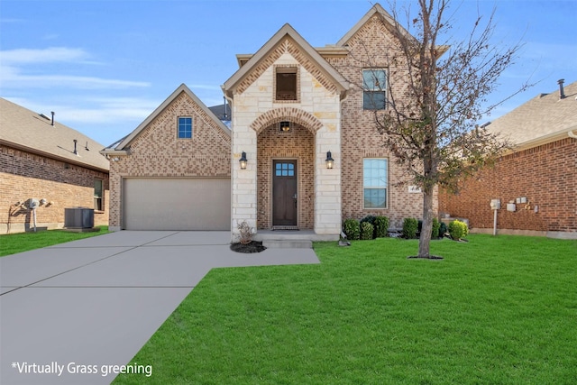 view of front of home featuring a front yard, a garage, and central air condition unit