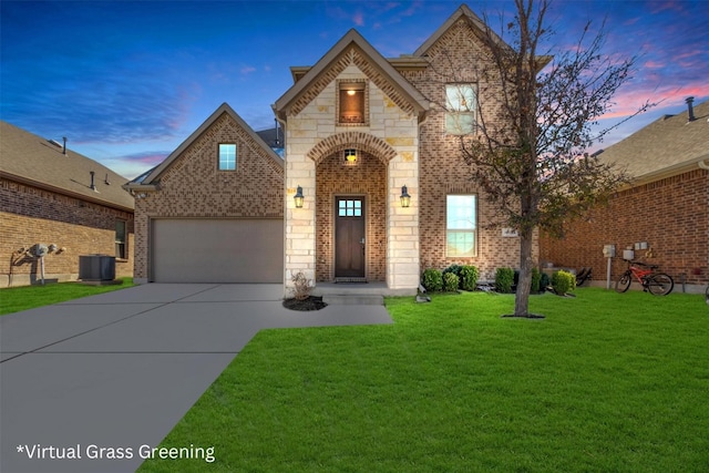 view of front of property with central AC unit and a lawn