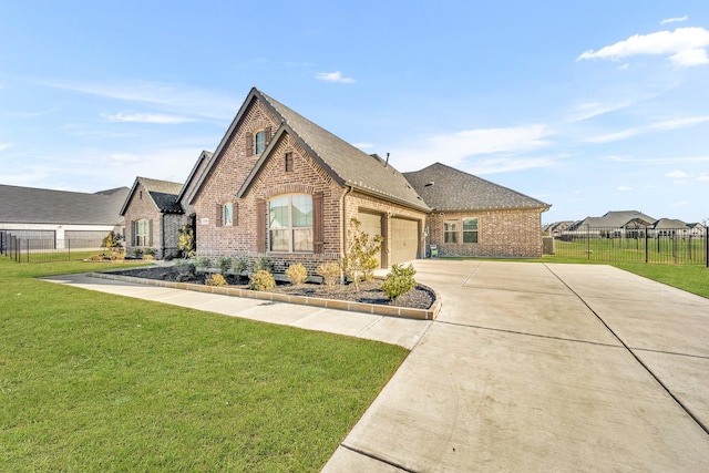 view of front of house featuring a garage and a front lawn