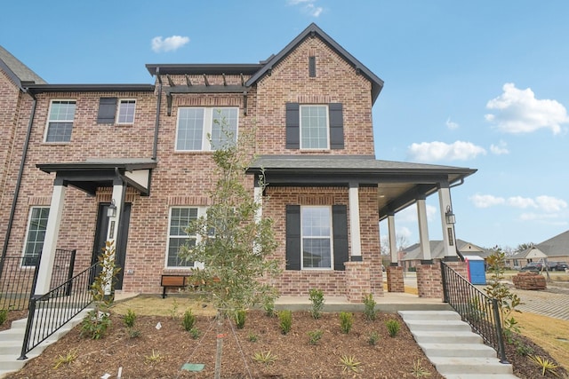2402 Bulin Dr, Mansfield, TX 76063 - view of front facade with covered porch and brick siding