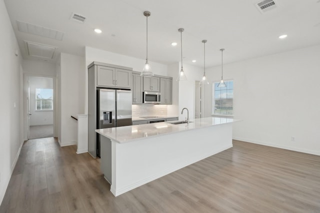 2402 Bulin Dr, Mansfield, TX 76063 - kitchen with visible vents, a sink, stainless steel appliances, and gray cabinets