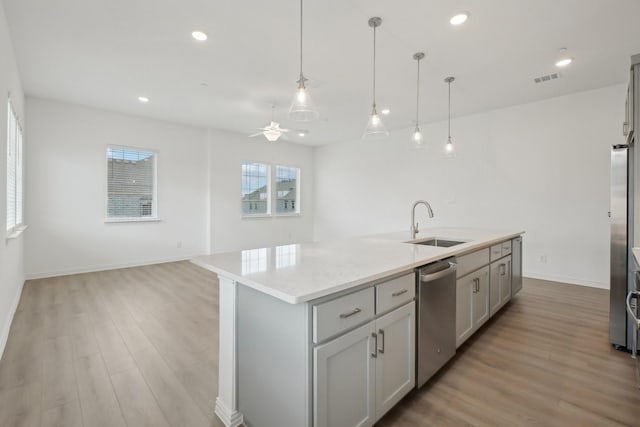 2402 Bulin Dr, Mansfield, TX 76063 - kitchen with visible vents, ceiling fan, a sink, open floor plan, and stainless steel dishwasher