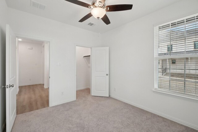 2402 Bulin Dr, Mansfield, TX 76063 - unfurnished bedroom with carpet floors, a walk in closet, baseboards, and visible vents