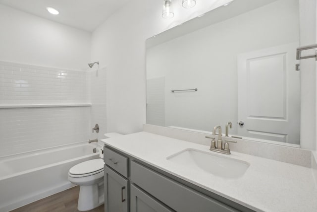 2402 Bulin Dr, Mansfield, TX 76063 - bathroom featuring wood finished floors,  shower combination, toilet, and vanity