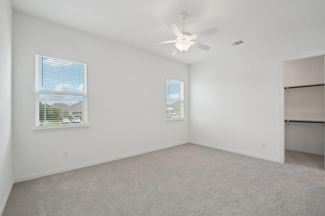 2402 Bulin Dr, Mansfield, TX 76063 - unfurnished bedroom with a walk in closet, baseboards, carpet floors, visible vents, and a ceiling fan