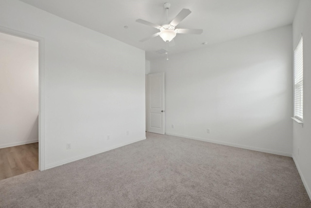 2402 Bulin Dr, Mansfield, TX 76063 - empty room featuring a ceiling fan, baseboards, and light colored carpet