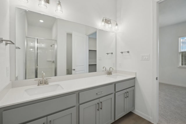 2402 Bulin Dr, Mansfield, TX 76063 - full bathroom with double vanity, a sink, a stall shower, and baseboards