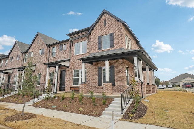 2402 Bulin Dr, Mansfield, TX 76063 - view of front facade with a front lawn and brick siding