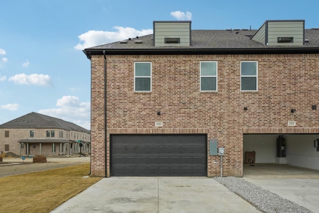 2402 Bulin Dr, Mansfield, TX 76063 - view of side of property featuring driveway, an attached garage, and brick siding