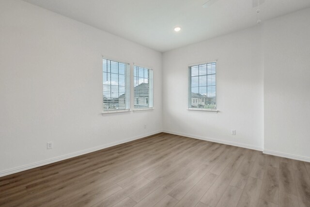 2402 Bulin Dr, Mansfield, TX 76063 - unfurnished room featuring a ceiling fan, recessed lighting, baseboards, and wood finished floors