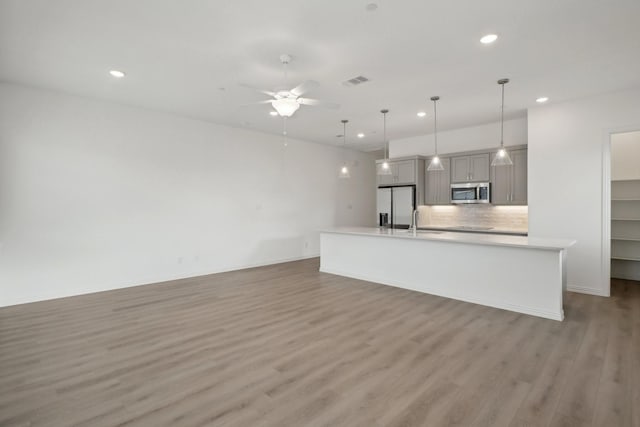 2402 Bulin Dr, Mansfield, TX 76063 - kitchen with light countertops, stainless steel appliances, gray cabinetry, visible vents, and ceiling fan