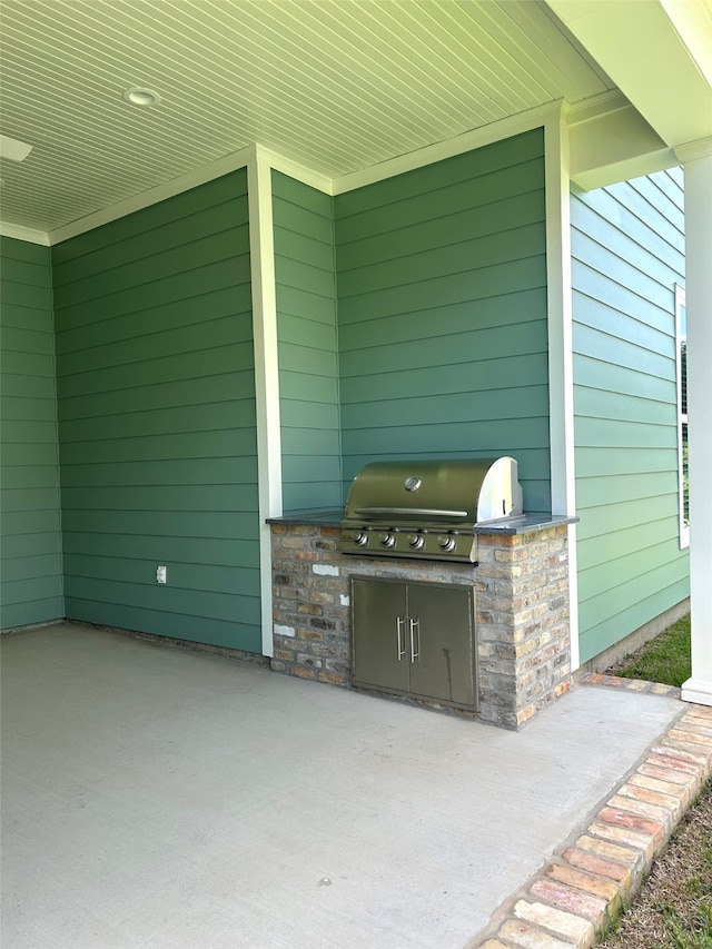 2129 Pecan Square Ave, Shreveport, LA 71106 - view of patio featuring exterior kitchen