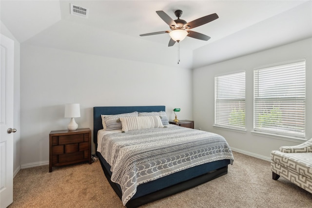 bedroom with light colored carpet, ceiling fan, and lofted ceiling