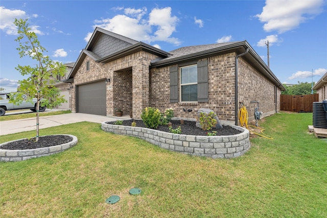 view of front facade with a front yard and a garage