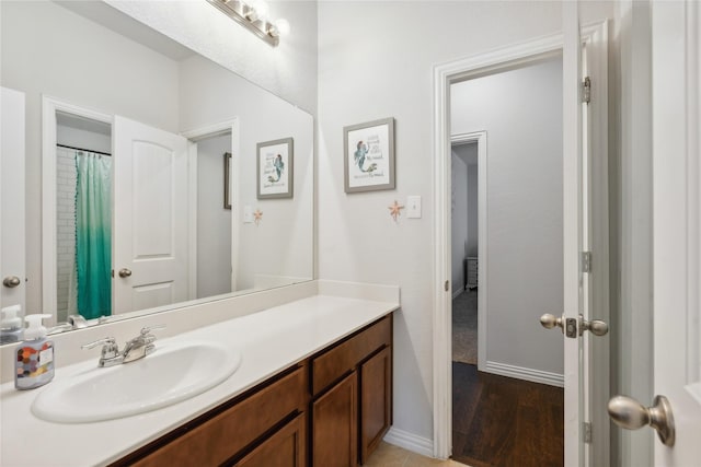 bathroom featuring hardwood / wood-style floors and vanity