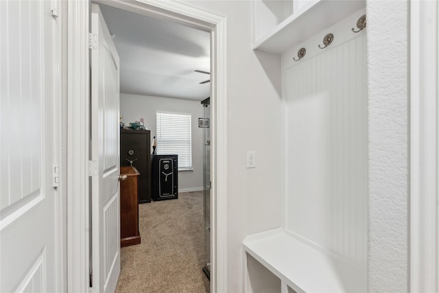 mudroom featuring light colored carpet and ceiling fan