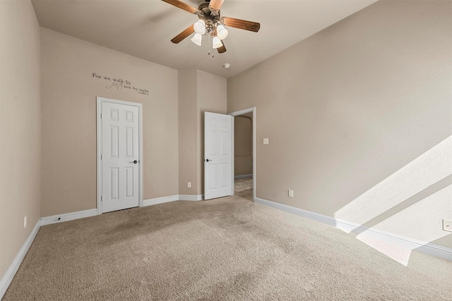 unfurnished bedroom featuring carpet flooring and ceiling fan