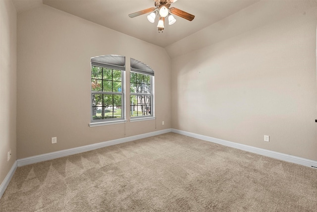 unfurnished room with carpet, lofted ceiling, and ceiling fan