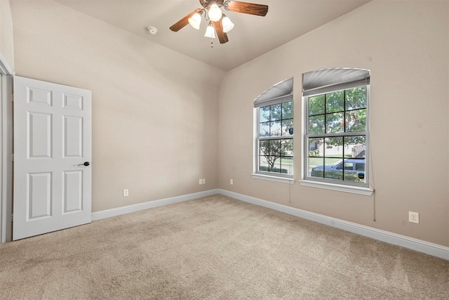 spare room featuring ceiling fan and light colored carpet