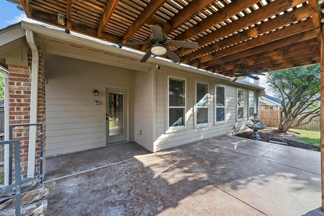 carpeted empty room featuring ceiling fan and vaulted ceiling