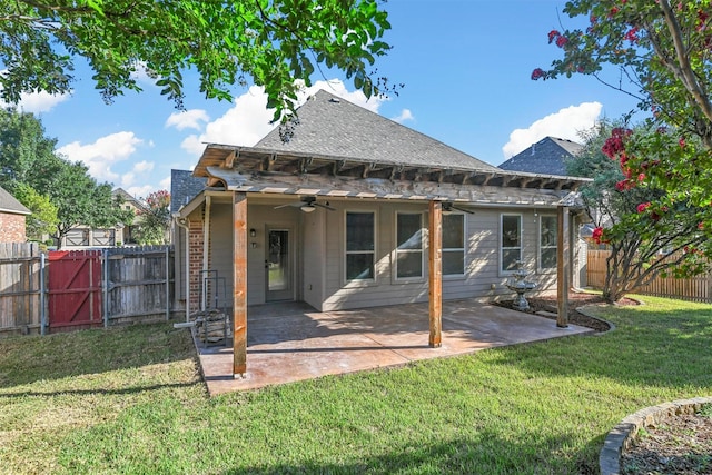 rear view of house with a yard, a patio, and ceiling fan