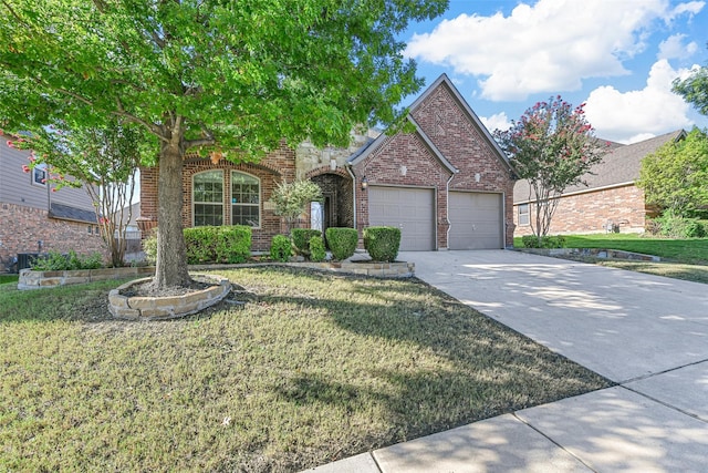 view of front of house with a garage and a front lawn