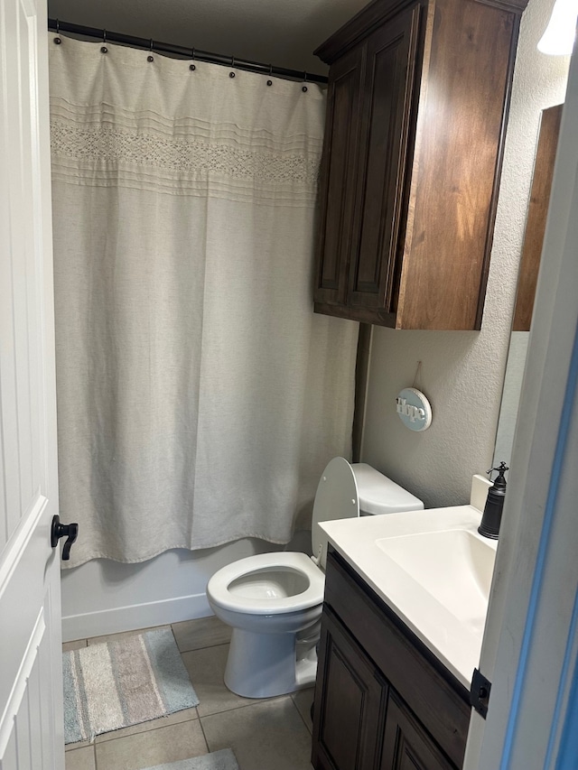 full bathroom with tile patterned flooring, vanity, toilet, and shower / bathtub combination with curtain