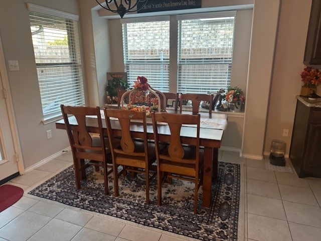 dining area with plenty of natural light and light tile patterned flooring