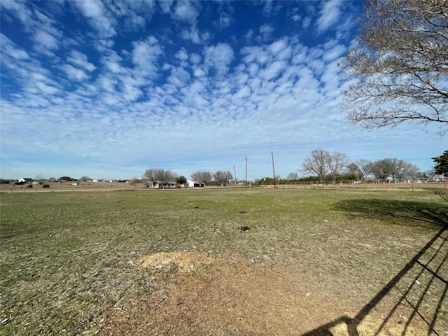 view of yard with a rural view