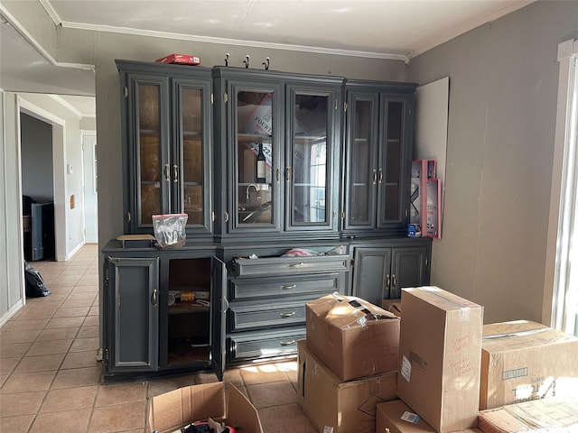 bar featuring ornamental molding and light tile patterned flooring