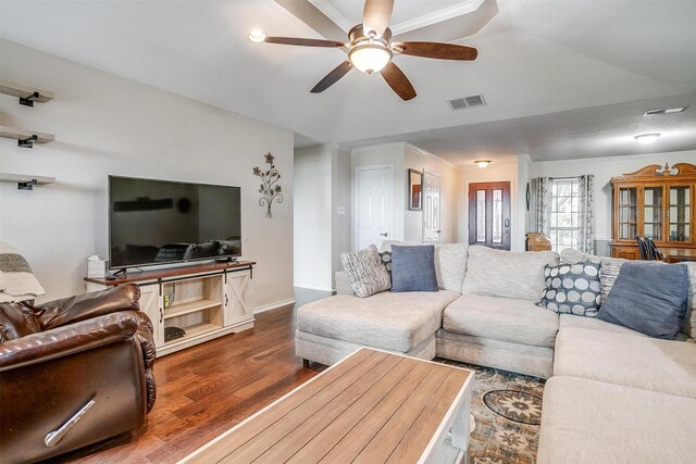 living room featuring hardwood / wood-style floors, ceiling fan, and crown molding