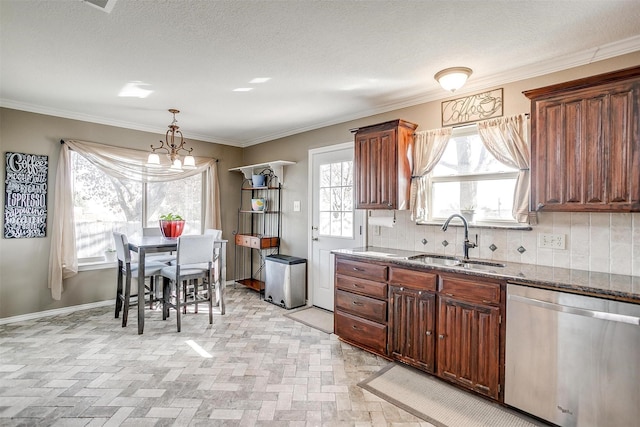 kitchen featuring tasteful backsplash, stainless steel dishwasher, crown molding, sink, and an inviting chandelier