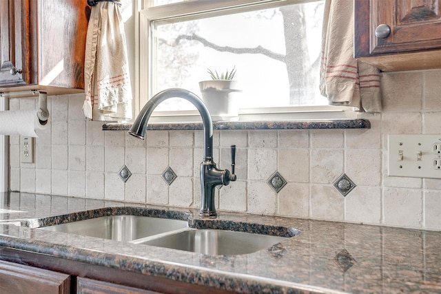 interior details with decorative backsplash and sink