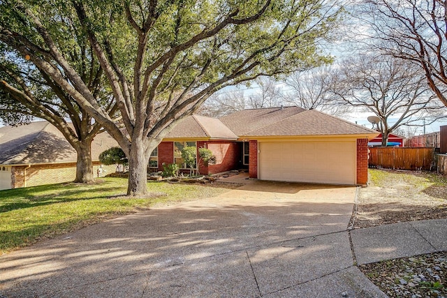 ranch-style home featuring a garage and a front yard