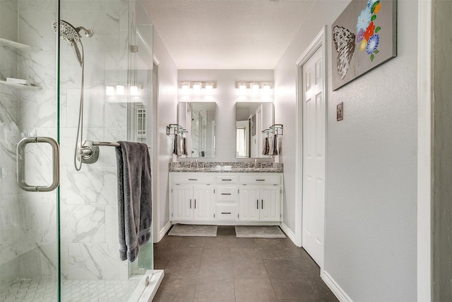 bathroom featuring a textured ceiling, vanity, tasteful backsplash, and an enclosed shower