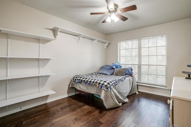 bedroom featuring ceiling fan and dark wood-type flooring