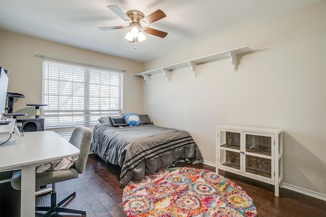 bedroom with ceiling fan and dark wood-type flooring