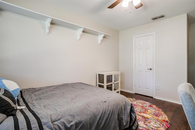 bedroom featuring ceiling fan and dark hardwood / wood-style floors