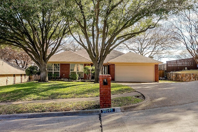 single story home with a garage and a front yard