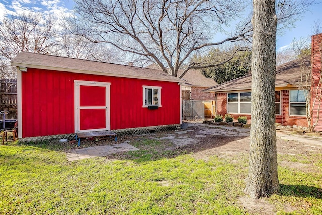 view of outbuilding with a yard