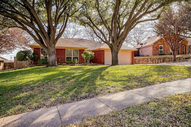 ranch-style home with a front yard and a garage