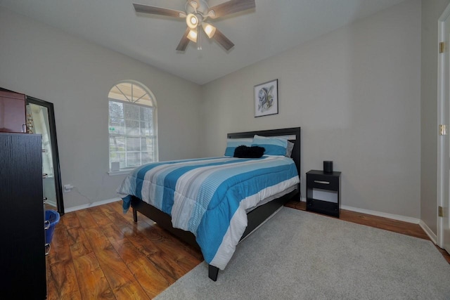 bedroom featuring dark hardwood / wood-style floors and ceiling fan