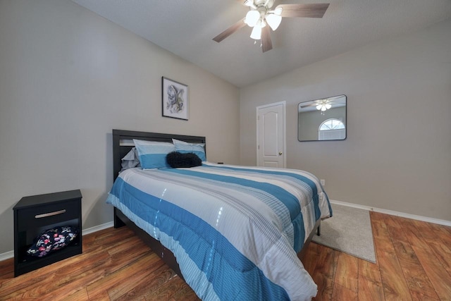 bedroom featuring ceiling fan and dark hardwood / wood-style flooring