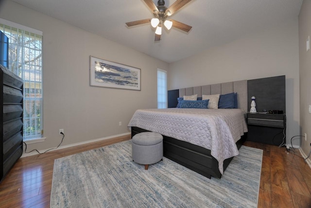 bedroom with ceiling fan and dark wood-type flooring