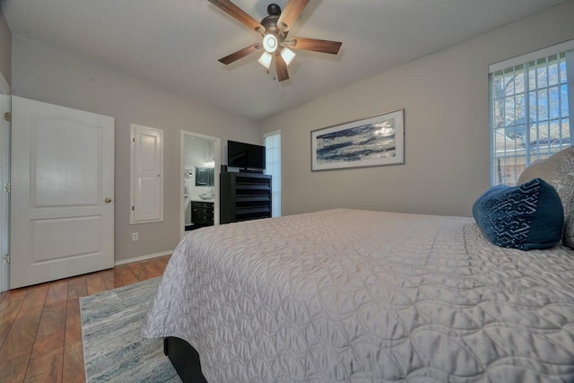 bedroom with ceiling fan and hardwood / wood-style flooring