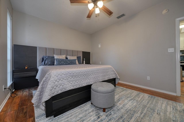 bedroom with ceiling fan and wood-type flooring