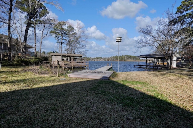 view of dock featuring a yard and a water view