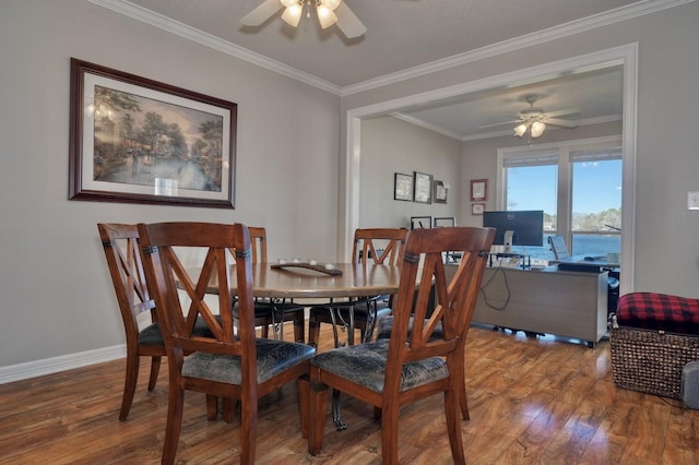 dining room featuring crown molding, hardwood / wood-style floors, and ceiling fan